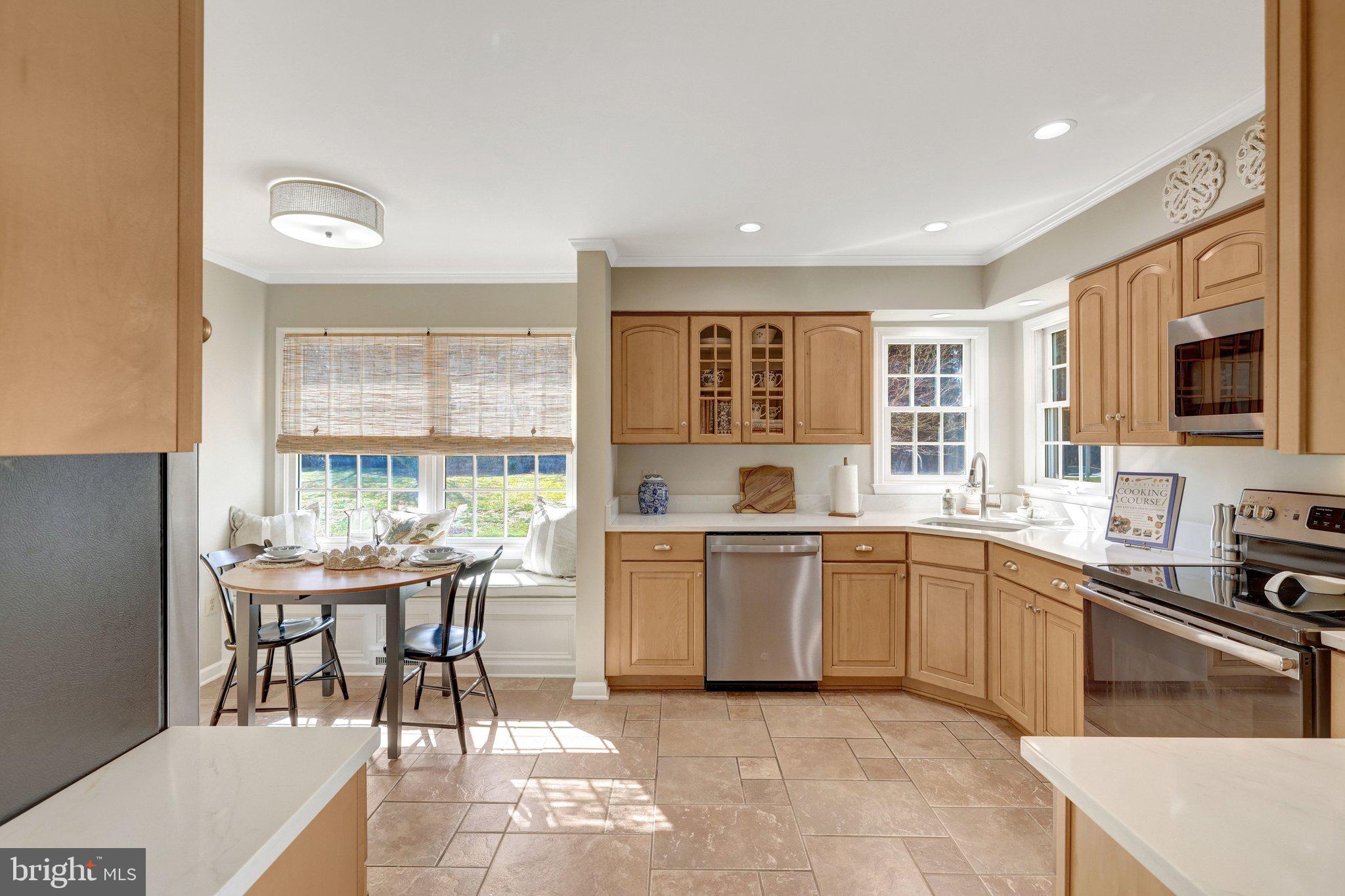 21039 Barcroft Way Sterling, VA 20164 - Photo 19 of 63 a kitchen with a sink stove and microwave