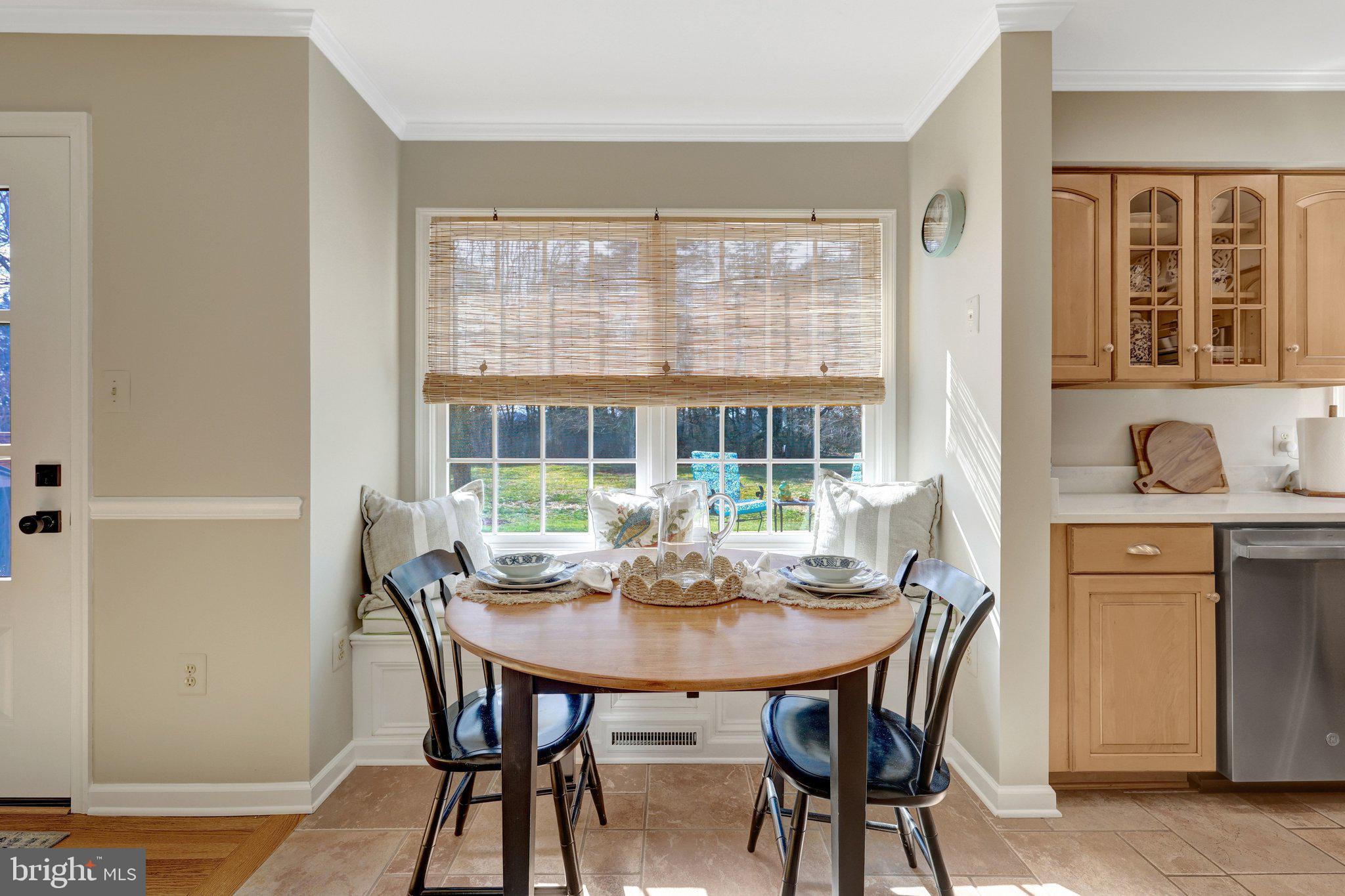 21039 Barcroft Way Sterling, VA 20164 - Photo 23 of 63 a view of a dining room with furniture window and outside view