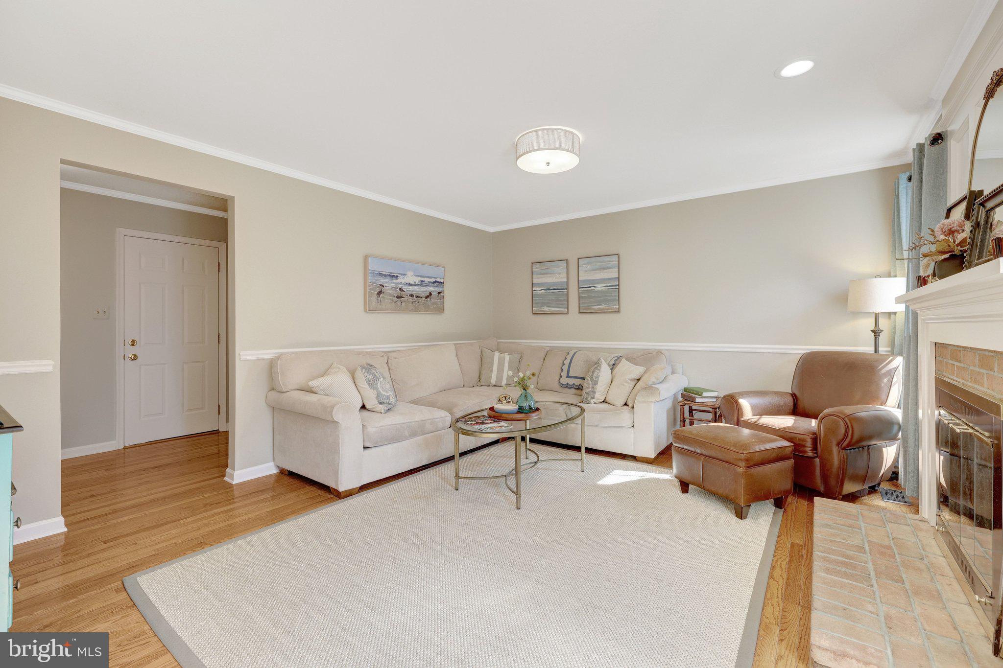 21039 Barcroft Way Sterling, VA 20164 - Photo 25 of 63 a living room with furniture and a fireplace