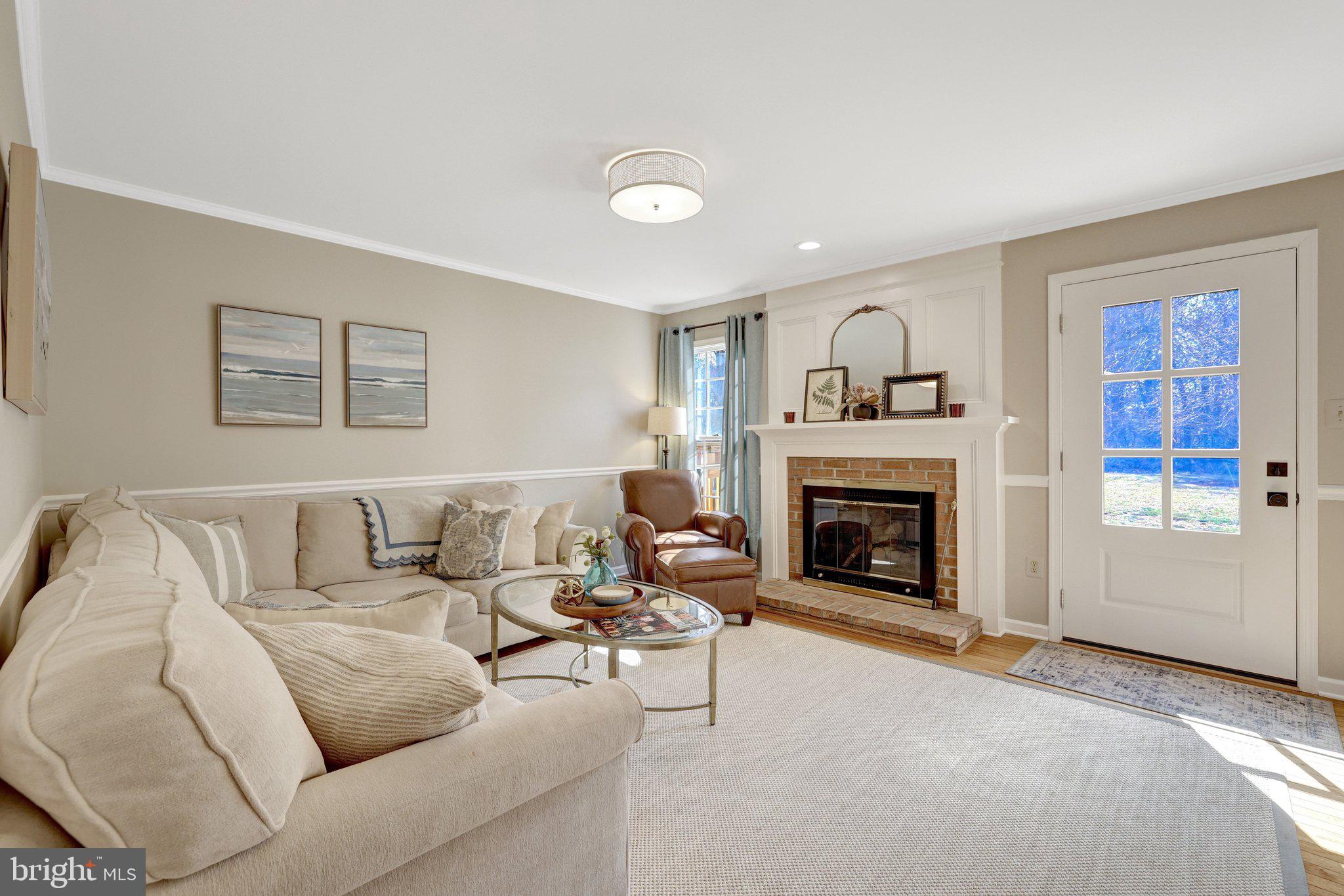 21039 Barcroft Way Sterling, VA 20164 - Photo 26 of 63 a living room with furniture and a fireplace