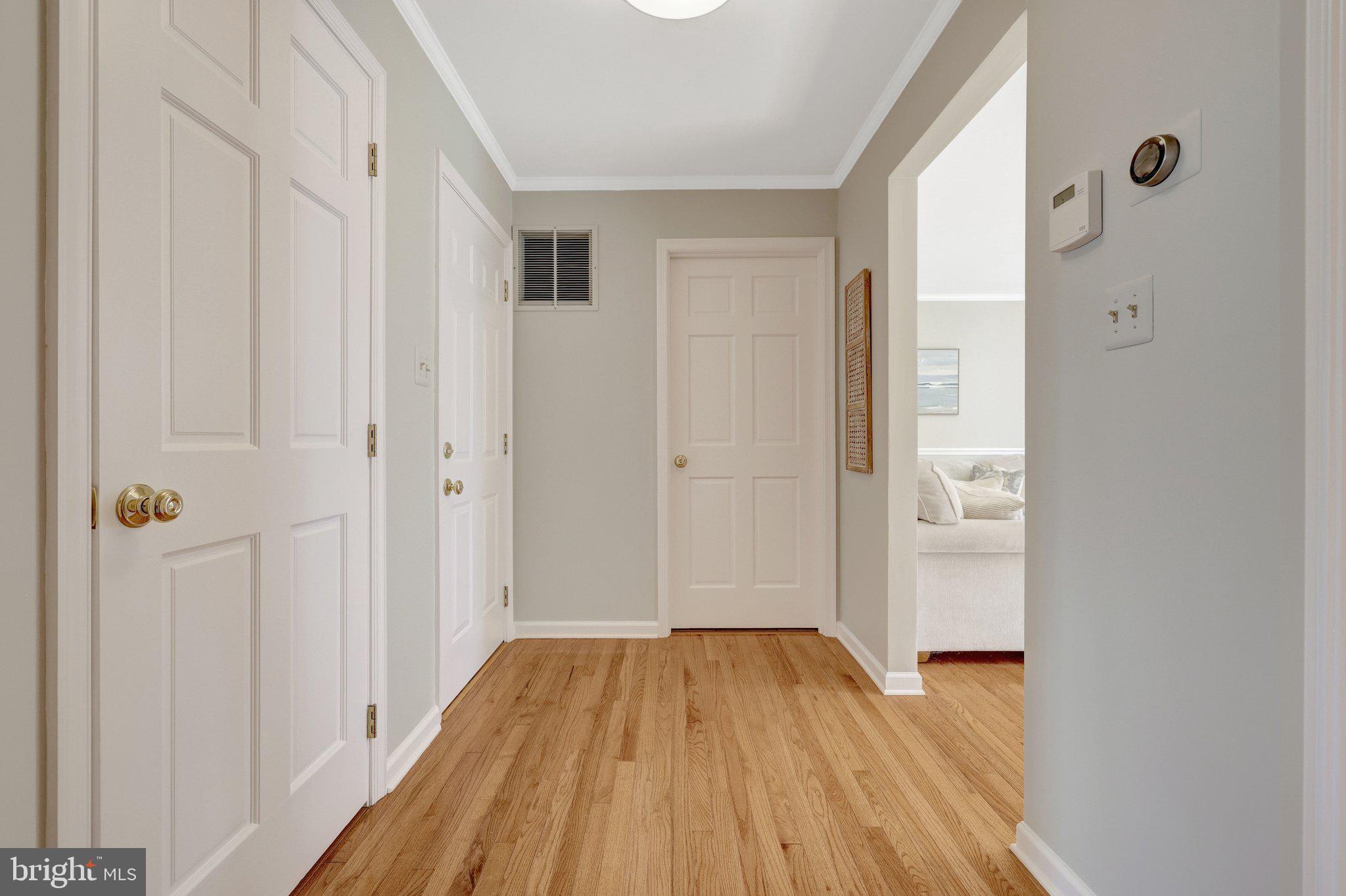 21039 Barcroft Way Sterling, VA 20164 - Photo 28 of 63 a view of a hallway with wooden floor