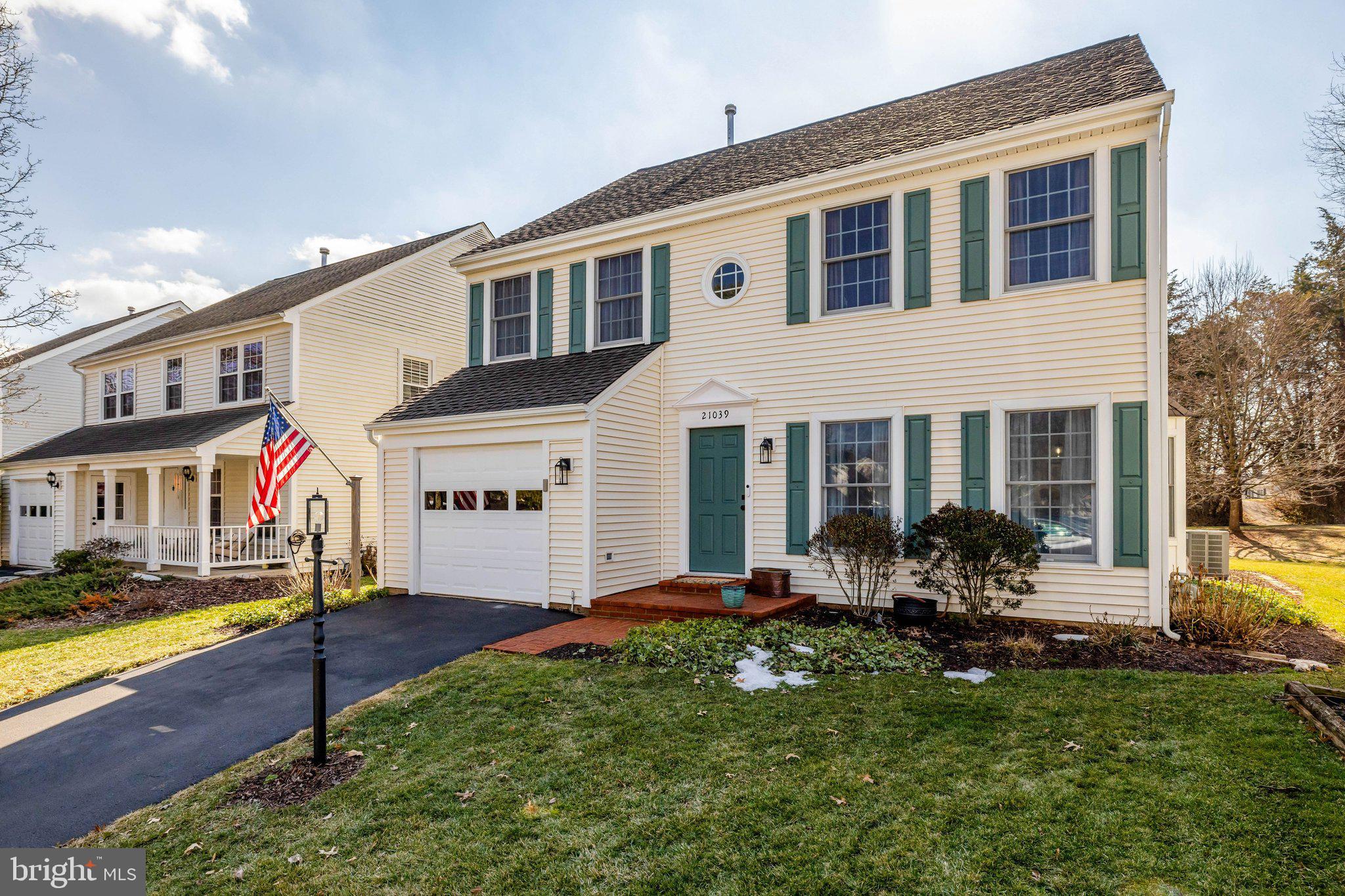 21039 Barcroft Way Sterling, VA 20164 - Photo 3 of 63 a front view of house with yard and outdoor seating