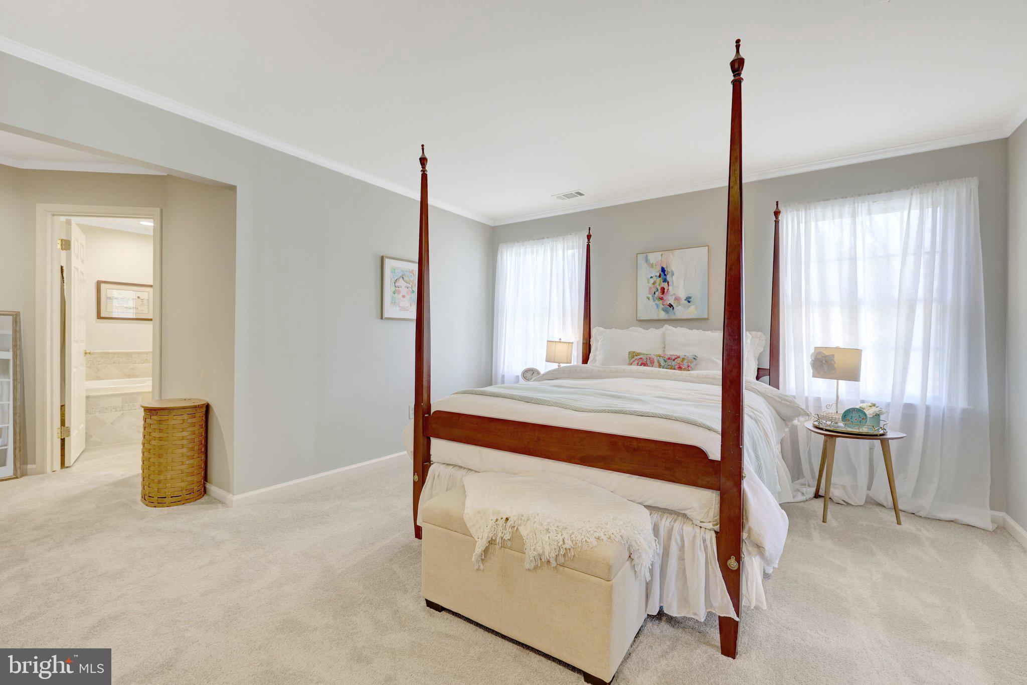 21039 Barcroft Way Sterling, VA 20164 - Photo 31 of 63 a bedroom with a bed and a table