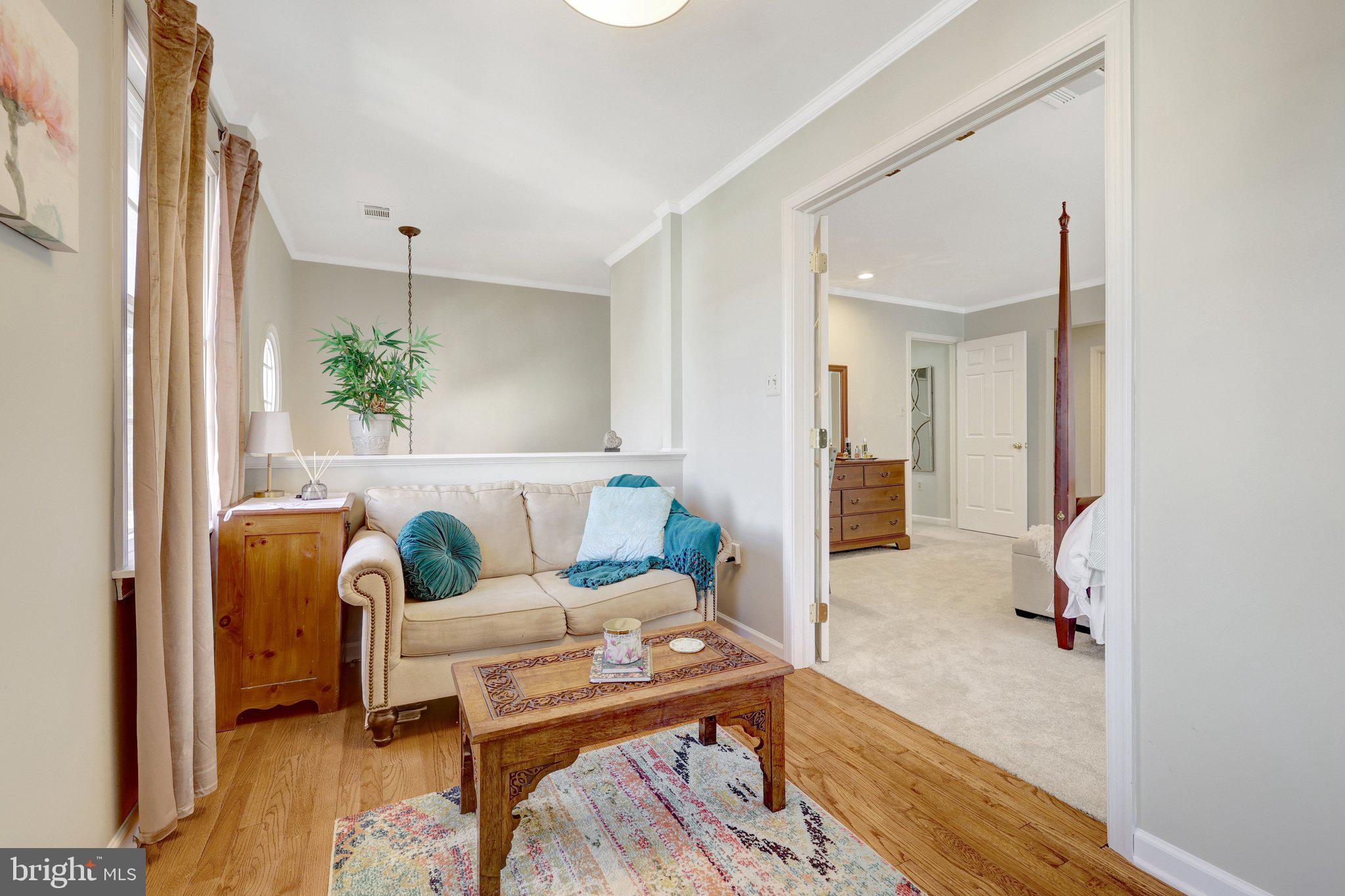 21039 Barcroft Way Sterling, VA 20164 - Photo 34 of 63 a living room with furniture and a table