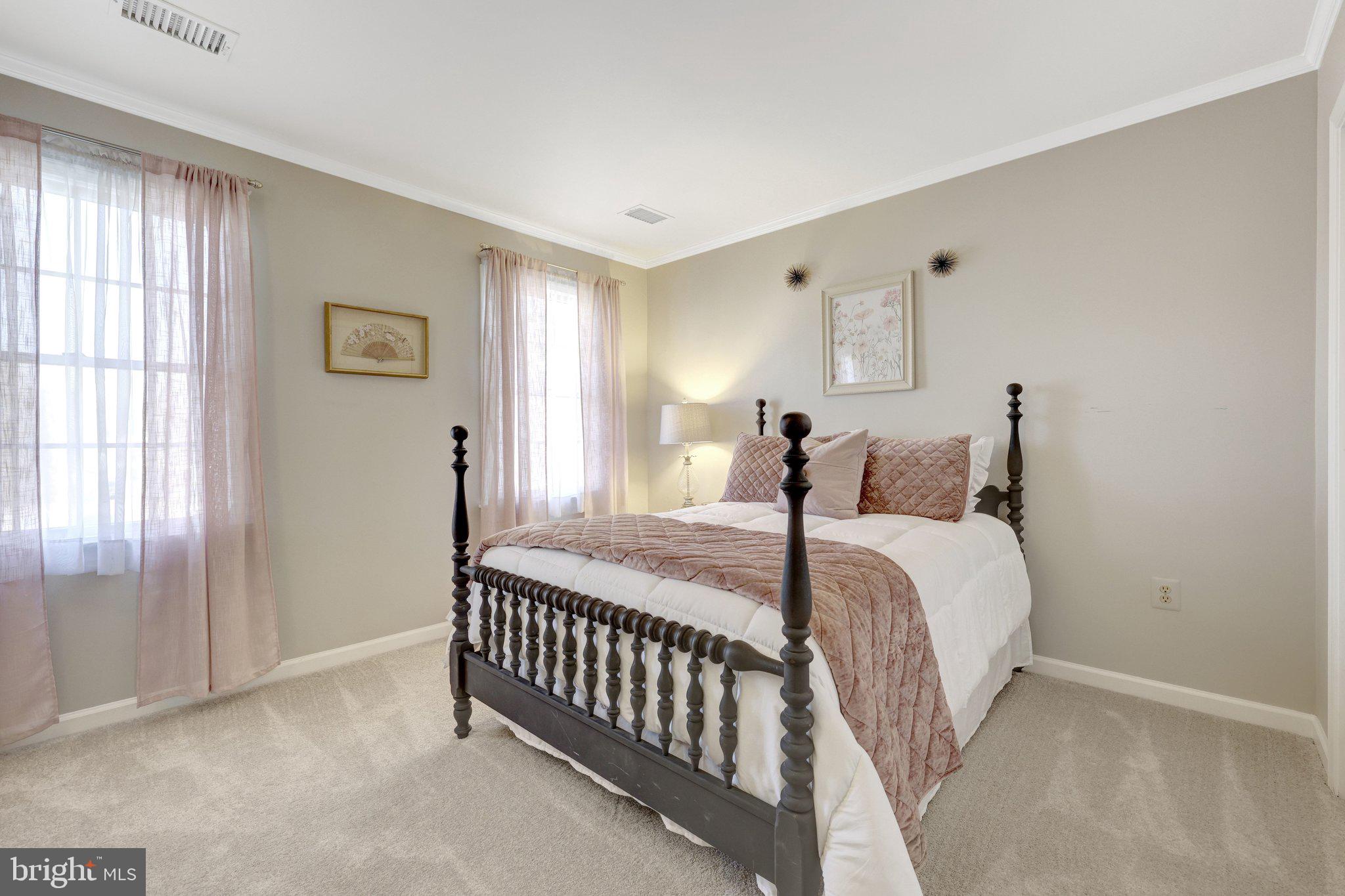 21039 Barcroft Way Sterling, VA 20164 - Photo 39 of 63 a bedroom with a bed and a window