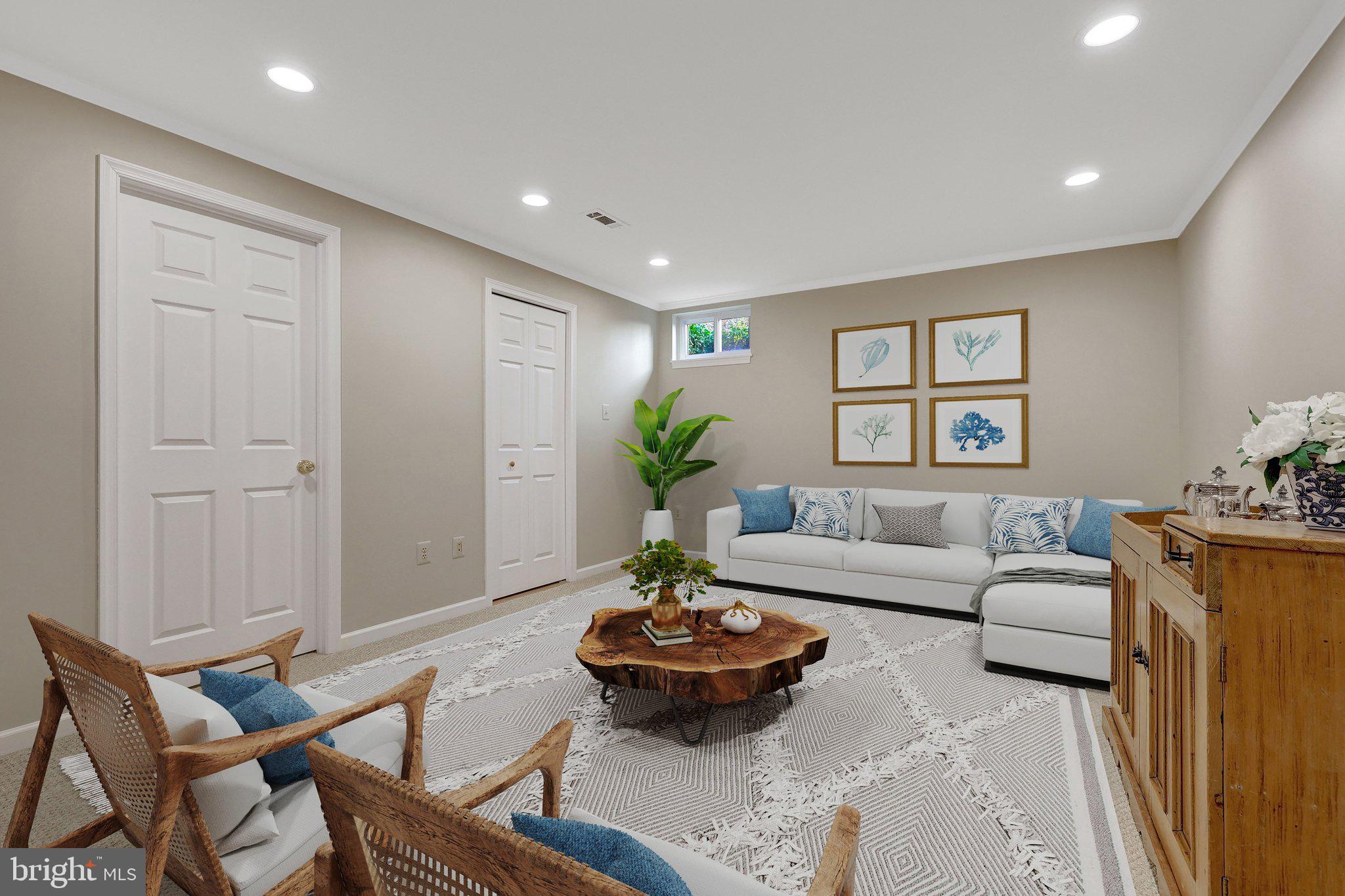 21039 Barcroft Way Sterling, VA 20164 - Photo 45 of 63 a living room with furniture and a potted plant