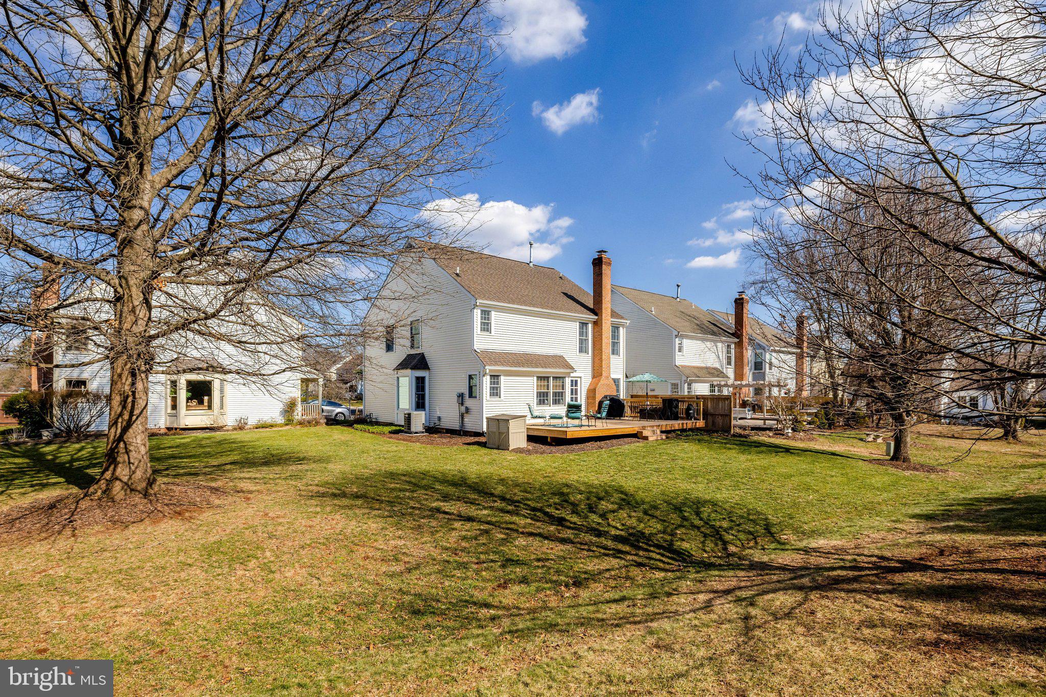 21039 Barcroft Way Sterling, VA 20164 - Photo 50 of 63 a view of a yard with a house in the background