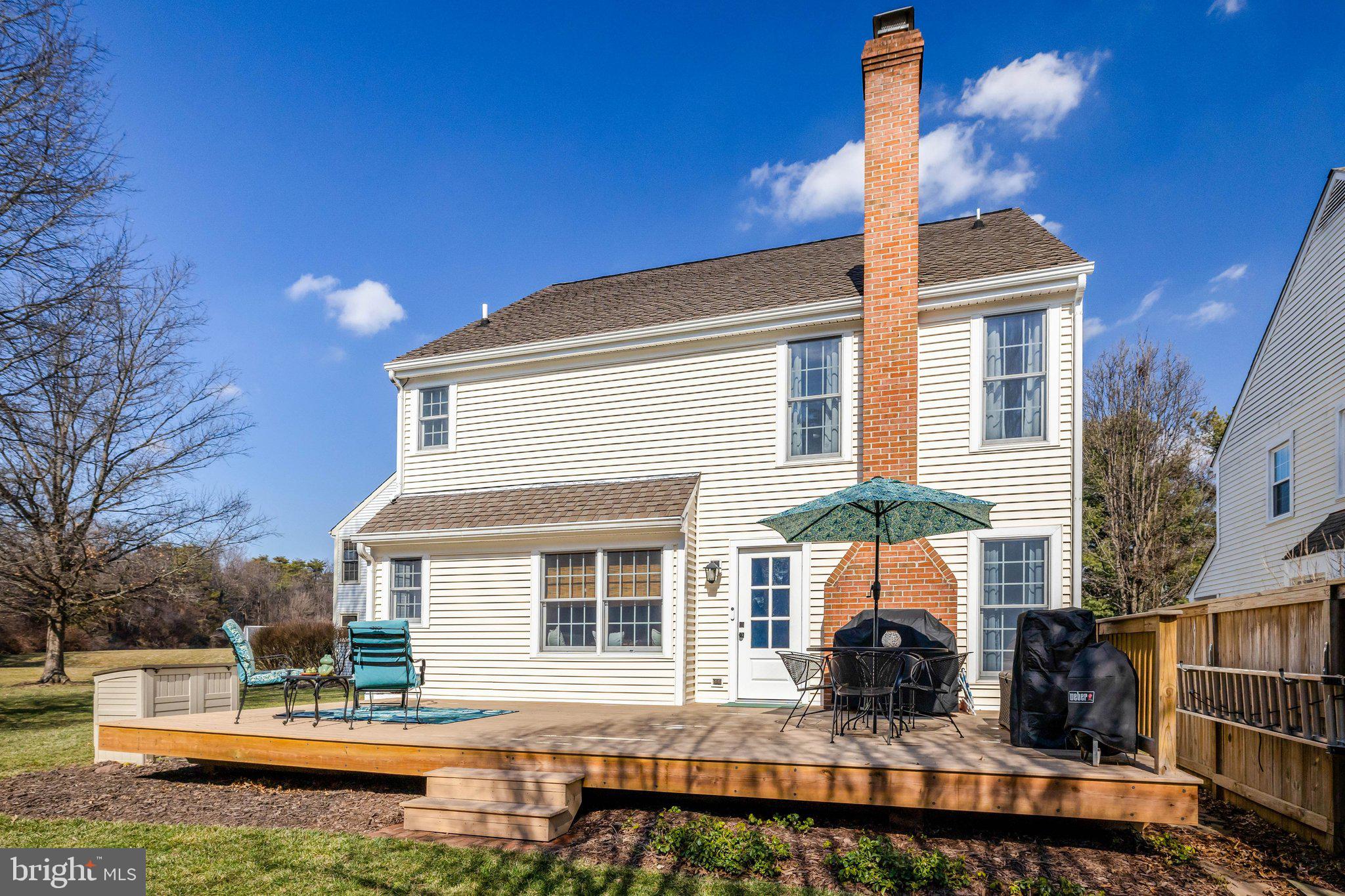 21039 Barcroft Way Sterling, VA 20164 - Photo 53 of 63 a front view of a house with a yard