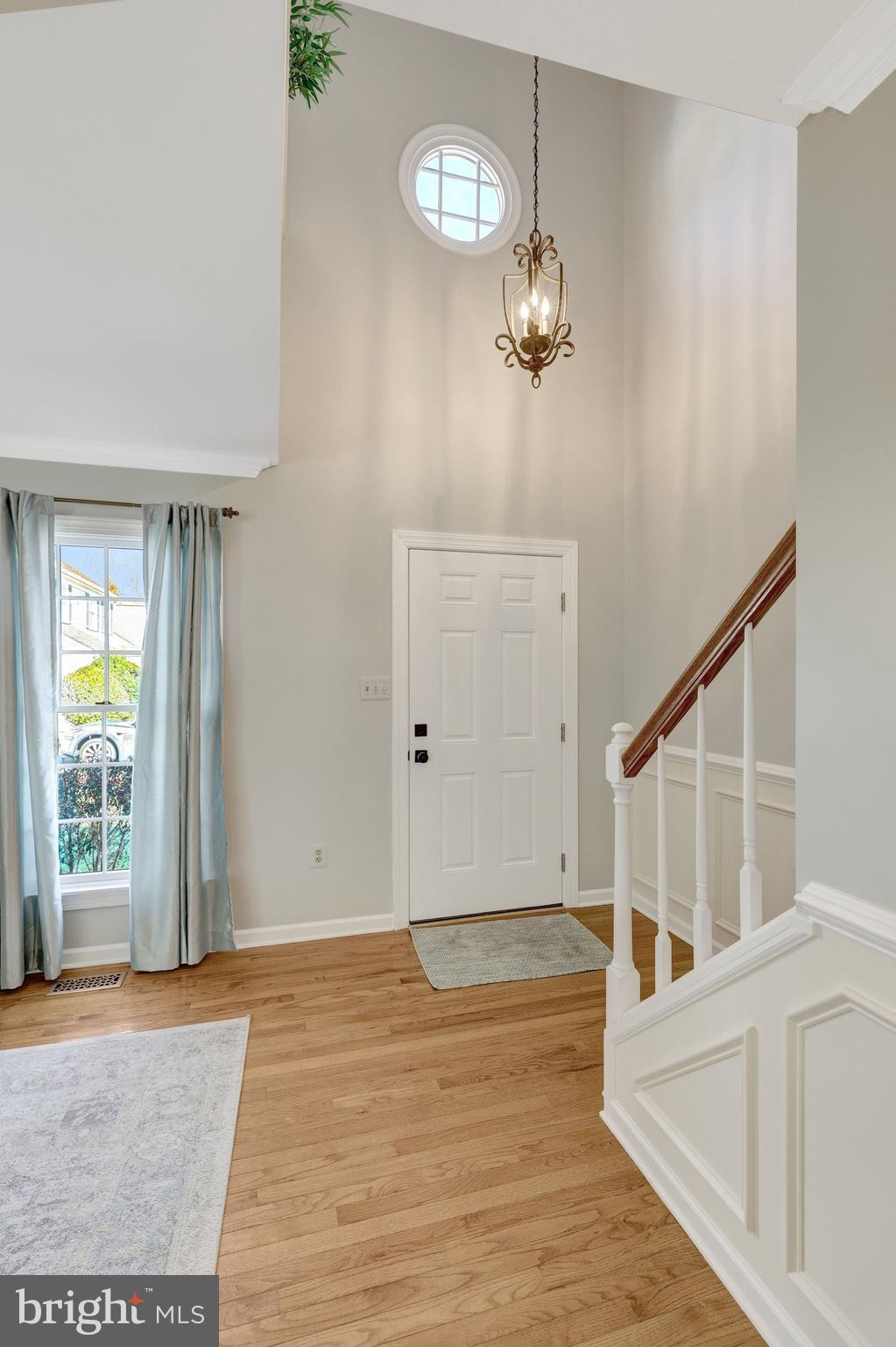 21039 Barcroft Way Sterling, VA 20164 - Photo 7 of 63 a view of a room with wooden floor and staircase