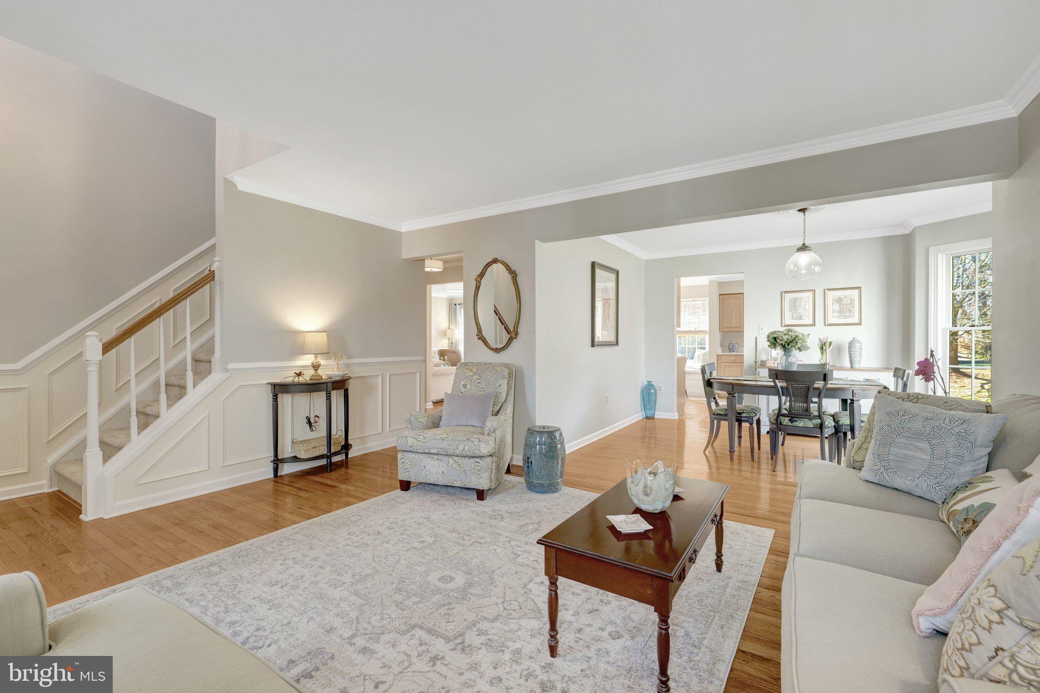 21039 Barcroft Way Sterling, VA 20164 - Photo 10 of 63 a living room with furniture a rug and a flat screen tv