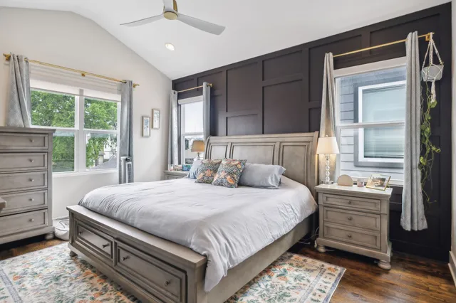 a bedroom with a bed and a dresser