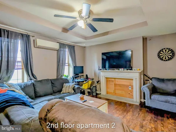 a bedroom with a bed and flat screen tv