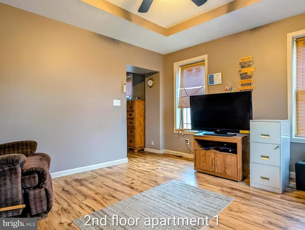 a view of kitchen with cabinets and wooden floor