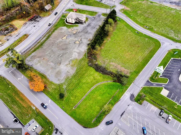 a view of a house with a patio and a yard
