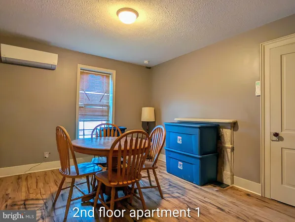 a view of a living room and a fireplace