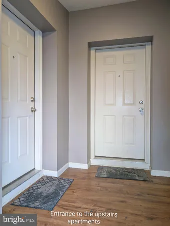 a view of fireplace and wooden floor
