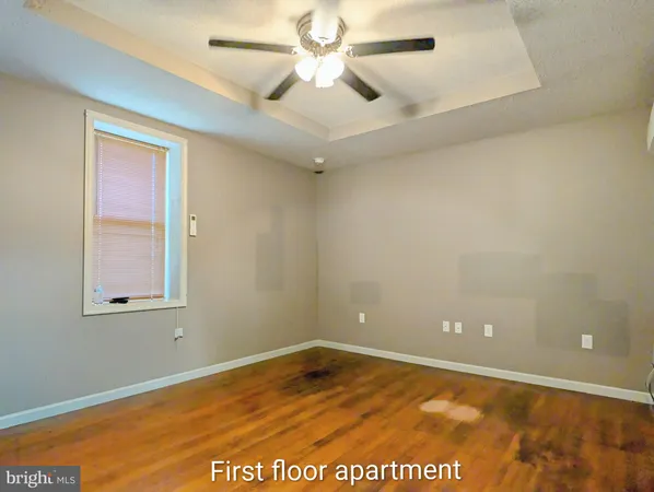 a kitchen with granite countertop a stove microwave and cabinets
