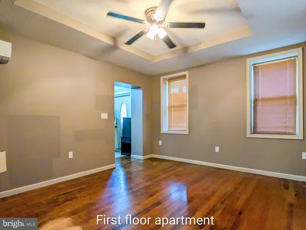 a kitchen with stainless steel appliances granite countertop a stove top oven a sink dishwasher and a refrigerator with wooden cabinets