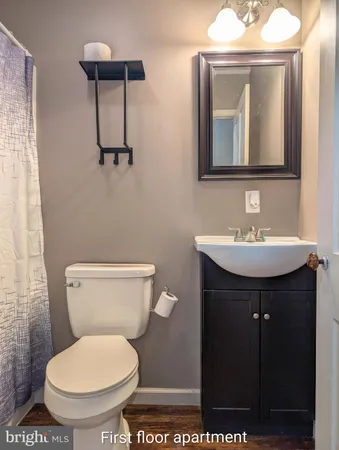 a view of empty room with wooden walls