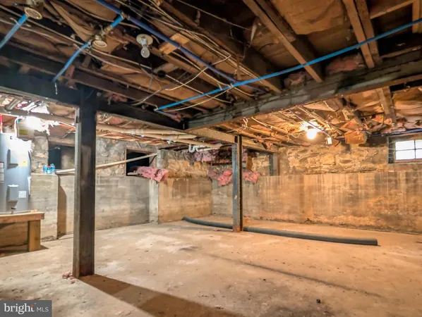 a view of a big house with a big yard and large trees