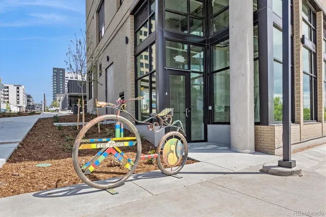 a view of a brick building with floor to ceiling windows