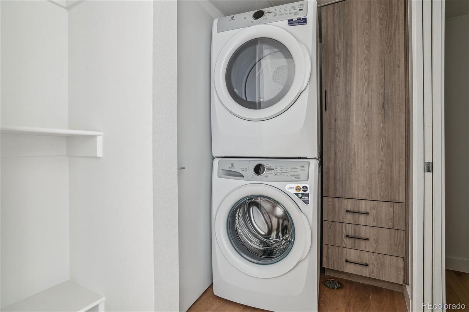 3575 Chestnut Place, Unit 402 Denver, CO 80216 - Photo 9 of 16 a utility room with dryer and washer