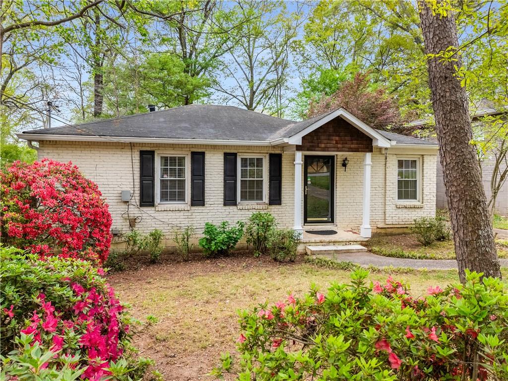 611 Daniel Avenue Decatur, GA 30032 - Photo 1 of 1 a front view of a house with a yard and fountain