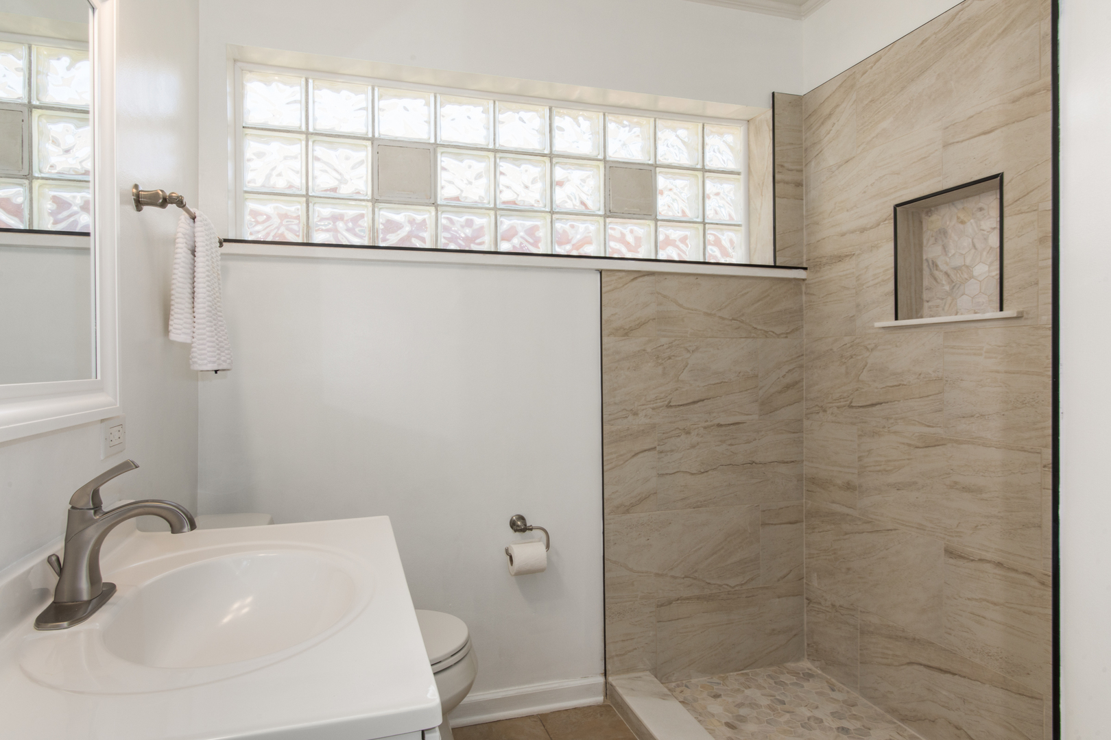 2020 Cherry Street Park Ridge, IL 60068 - Photo 13 of 23 a bathroom with a sink a toilet and a window