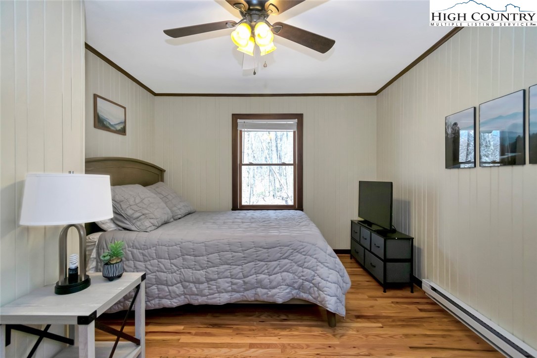 119 Overbrook Trail Beech Mountain, NC 28604 - Photo 13 of 27 a bedroom with a bed and a window