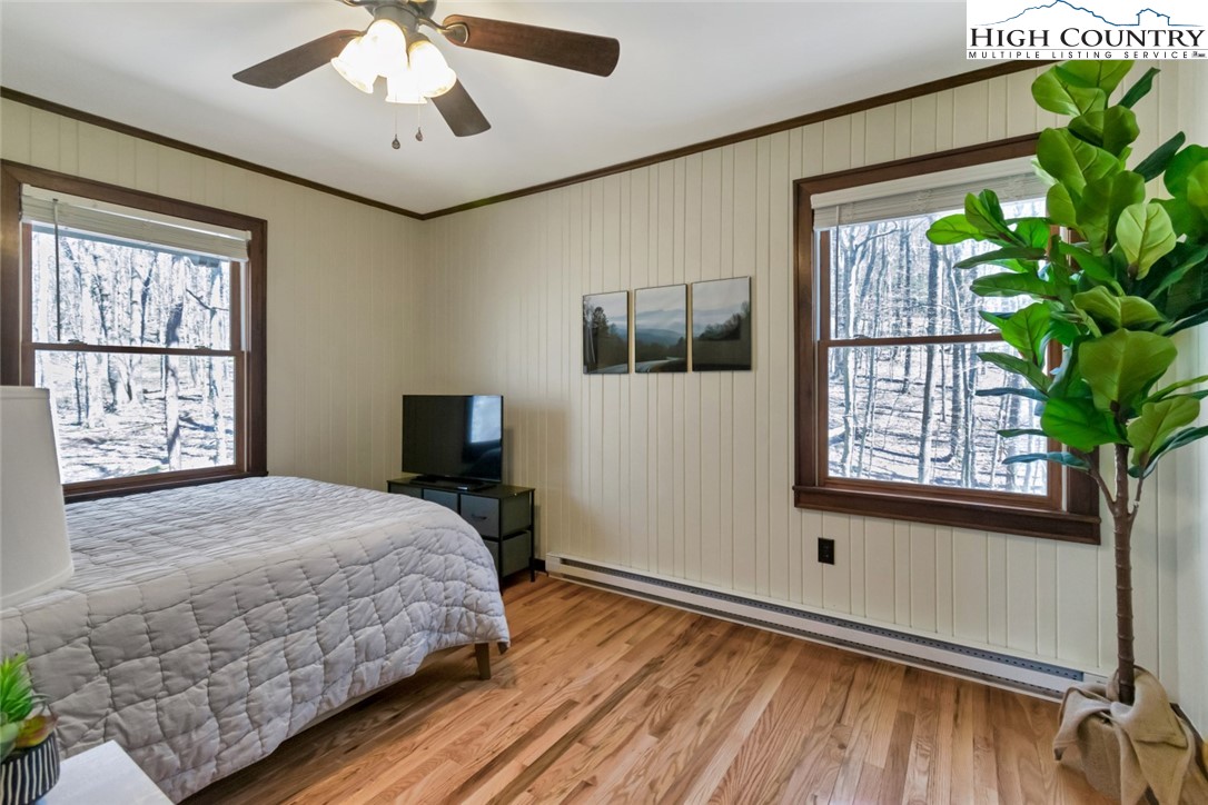 119 Overbrook Trail Beech Mountain, NC 28604 - Photo 14 of 27 a bedroom with a bed and a window