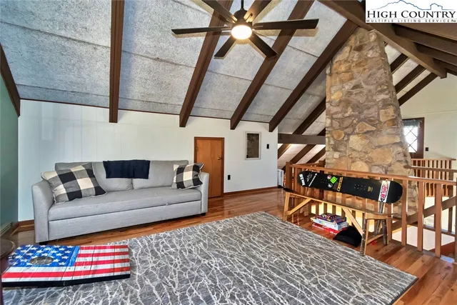 a living room with furniture and a rug