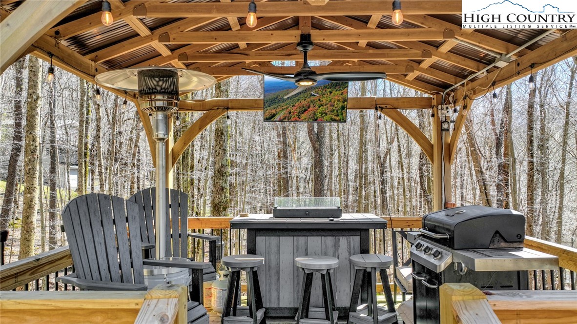 119 Overbrook Trail Beech Mountain, NC 28604 - Photo 26 of 27 a view of a chairs and table in the patio