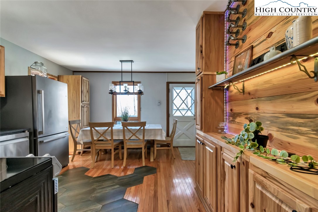 119 Overbrook Trail Beech Mountain, NC 28604 - Photo 8 of 27 a view of a dining room with furniture window and wooden floor