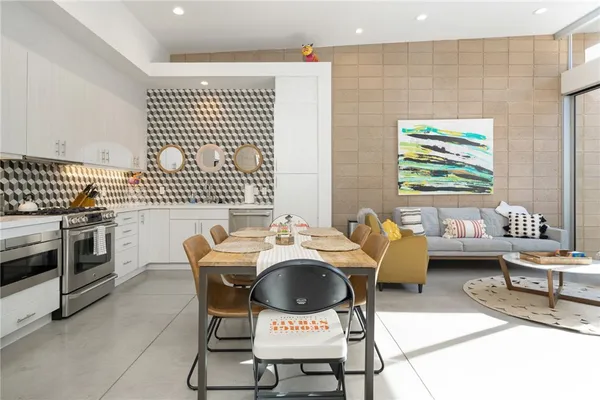 a dining room with furniture and window