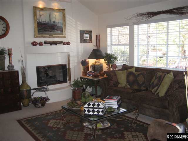 30 Targhee Court Reno, NV 89511 - Photo 4 of 9 a living room with furniture and a fireplace