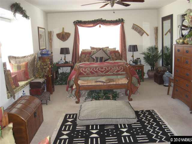 30 Targhee Court Reno, NV 89511 - Photo 6 of 9 a bed sitting in a bedroom next to a window