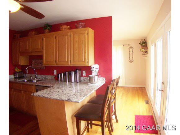 3788 Shutterlee Mill Road Staunton, VA 24401 - Photo 13 of 32 a dining room with furniture and a chandelier