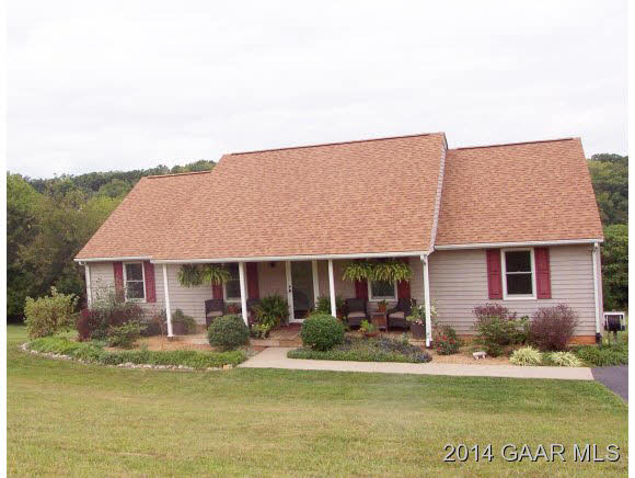 3788 Shutterlee Mill Road Staunton, VA 24401 - Photo 2 of 32 a front view of a house with a yard table and chairs