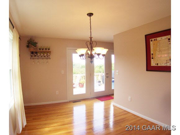 3788 Shutterlee Mill Road Staunton, VA 24401 - Photo 8 of 32 a view of a room with window wooden floor and a chandelier
