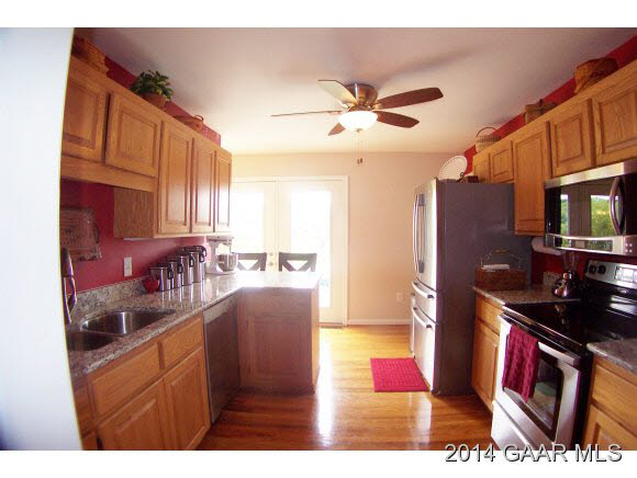 3788 Shutterlee Mill Road Staunton, VA 24401 - Photo 9 of 32 a kitchen with stainless steel appliances granite countertop a refrigerator stove top oven and sink