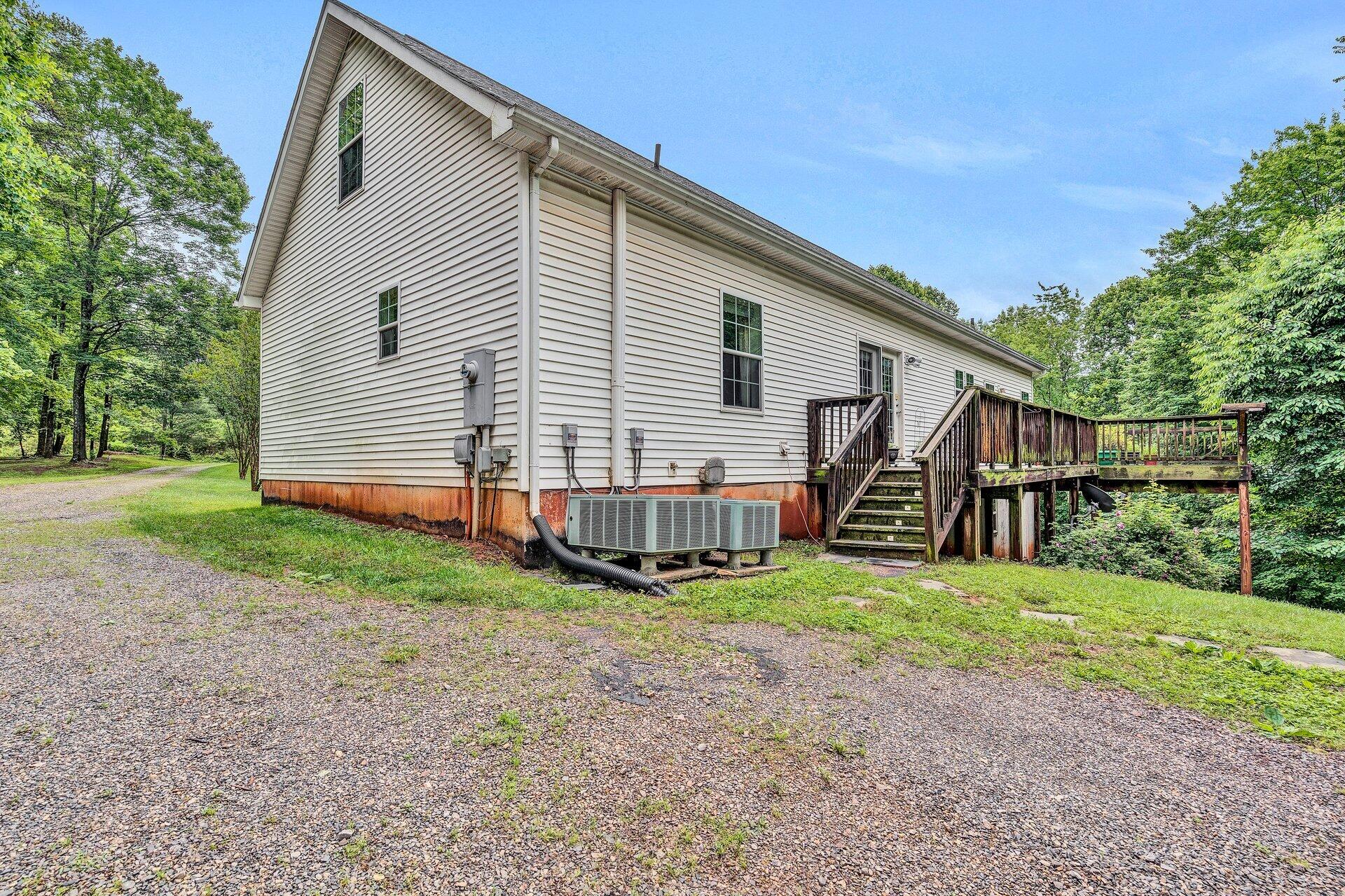 4004 Coopers Cove Road Hardy, VA 24101 - Photo 21 of 32 a view of a house with a yard and stairs