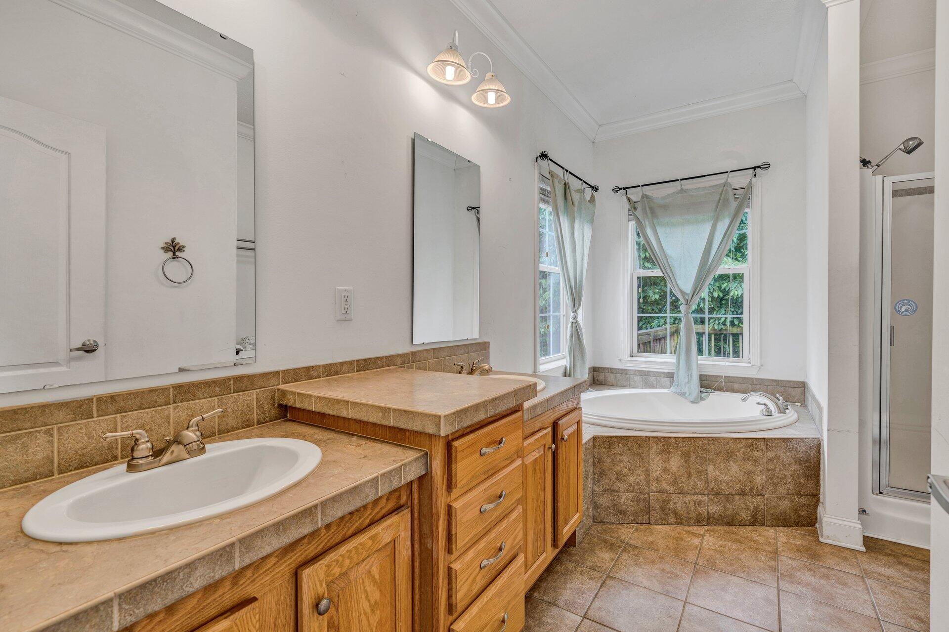 4004 Coopers Cove Road Hardy, VA 24101 - Photo 5 of 32 a spacious bathroom with a granite countertop sink and a mirror