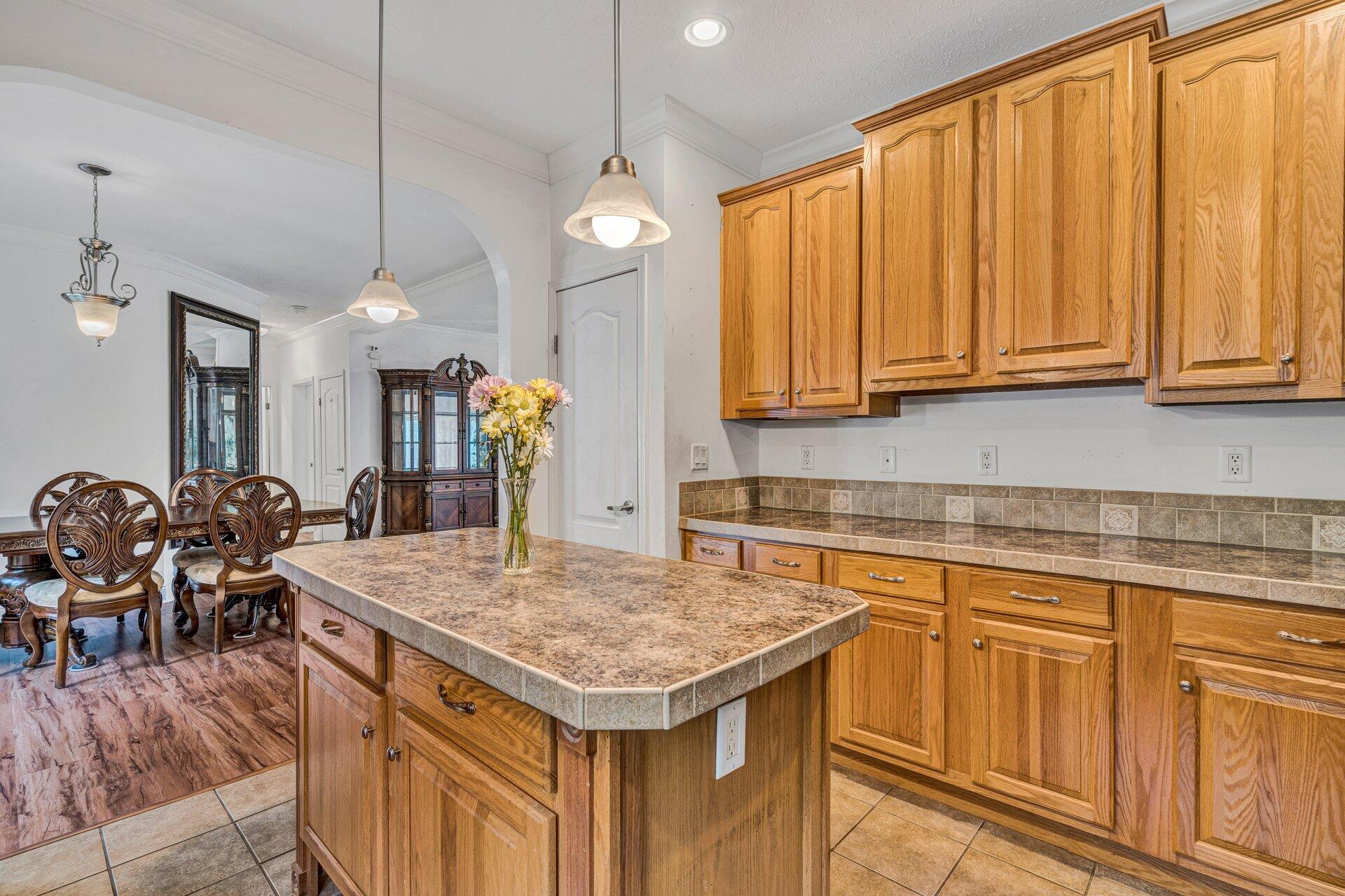 4004 Coopers Cove Road Hardy, VA 24101 - Photo 8 of 32 a kitchen with a table chairs cabinets and wooden floor