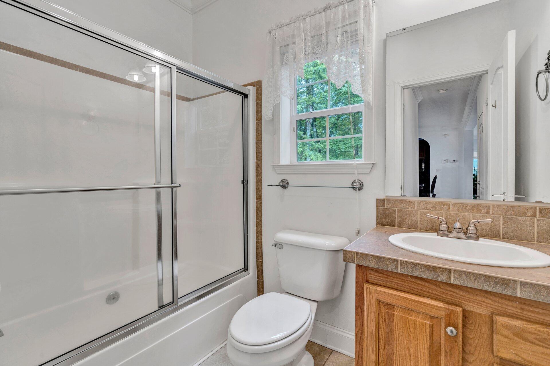 4004 Coopers Cove Road Hardy, VA 24101 - Photo 10 of 32 a bathroom with a sink toilet and shower