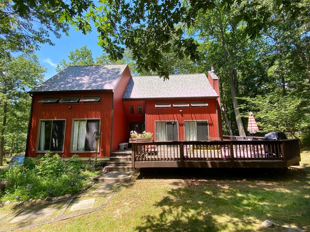 216 Jaycox Road Cold Spring, NY 10516 - Photo 1 of 1 a view of a house with a small yard plants and large tree