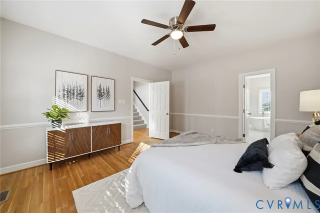 a spacious bathroom with double sink and a bathtub