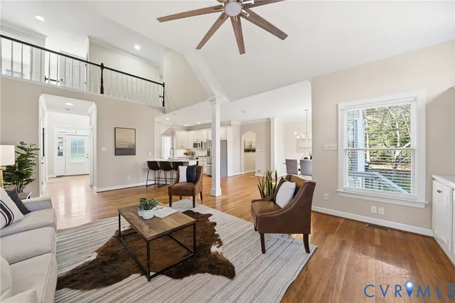 a living room with furniture a fireplace and a table