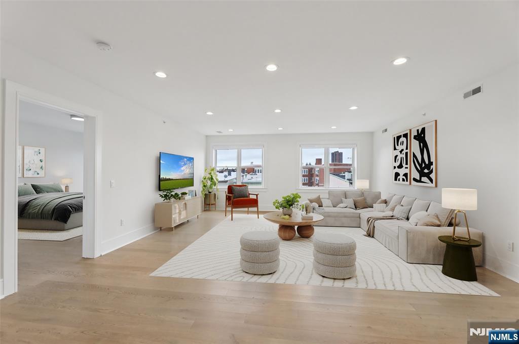 209-211 Hackensack Plank Road, Unit 5B Weehawken, NJ 07086 - Photo 2 of 30 a living room with furniture and a view of living room