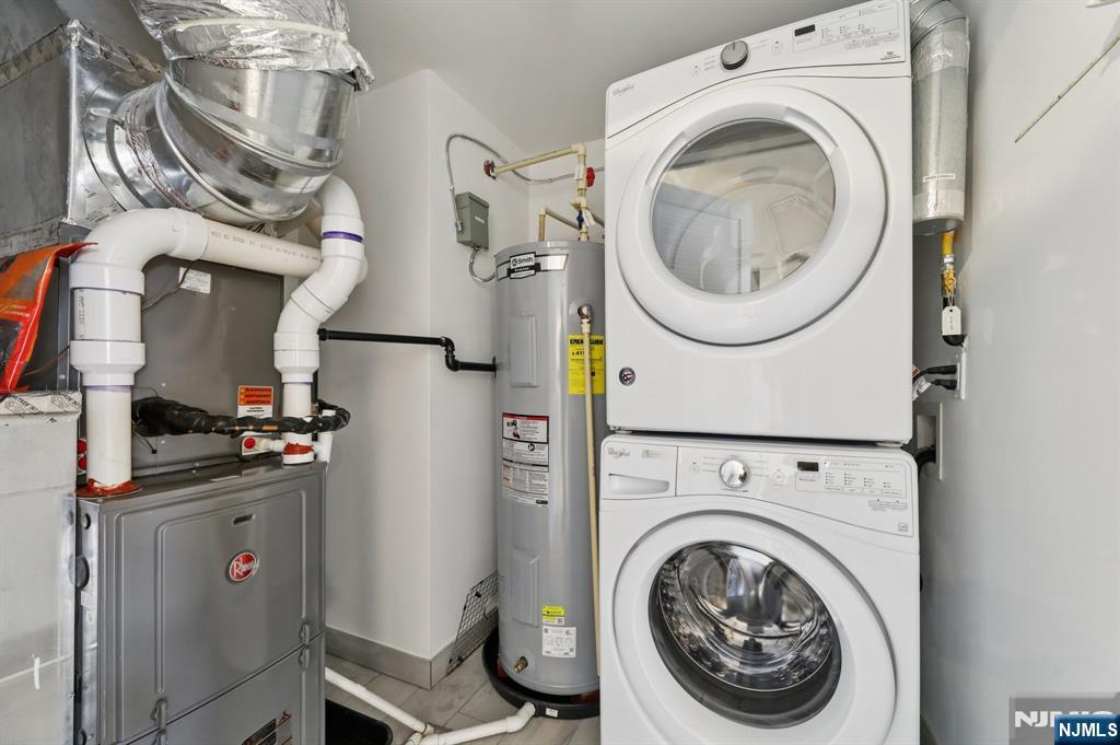 209-211 Hackensack Plank Road, Unit 5B Weehawken, NJ 07086 - Photo 28 of 30 a view of a storage and utility room with washer and dryer