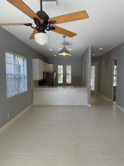 180 Paradise Circle Jupiter, FL 33458 - Photo 5 of 8 a view of a livingroom and a chandelier fan